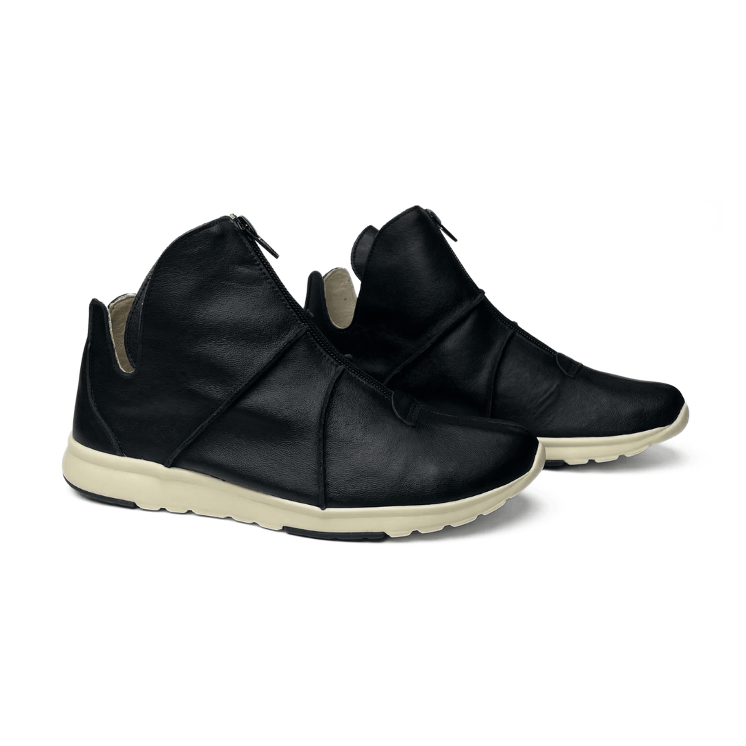Tênis casual feminino Rio de Luz em couro legítimo. Com design moderno e prático, o zíper frontal garante facilidade ao calçar. Conforto e elegância para o seu dia!